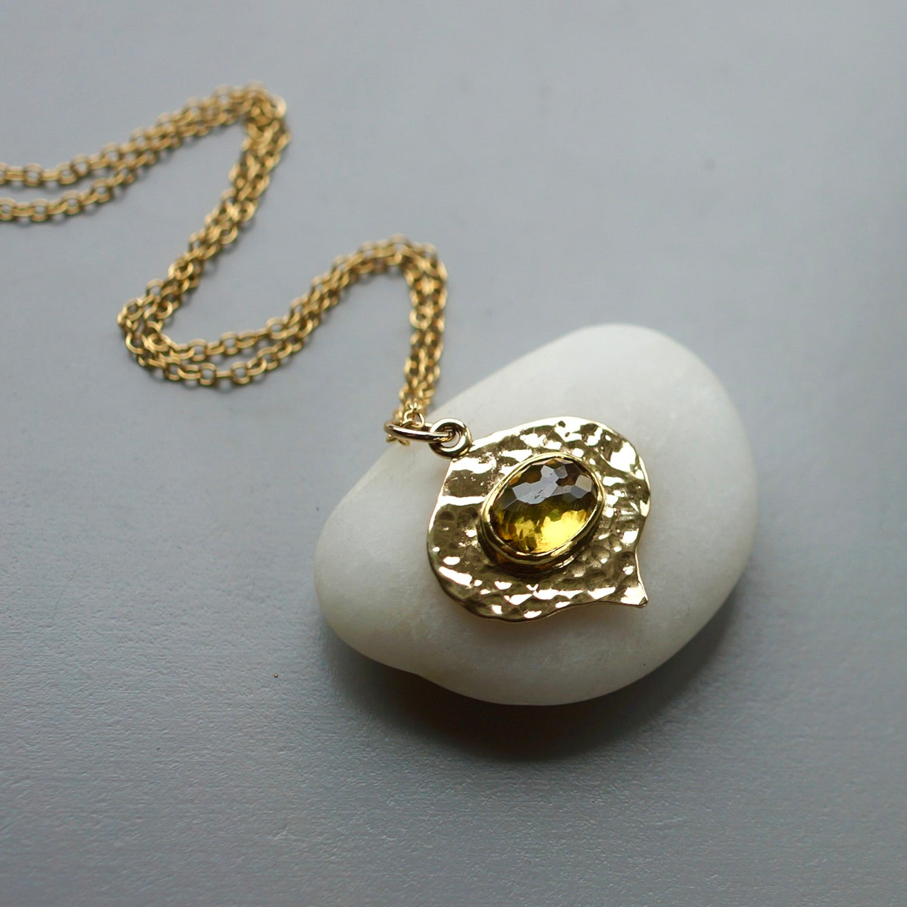 Solid gold green sphene pendant