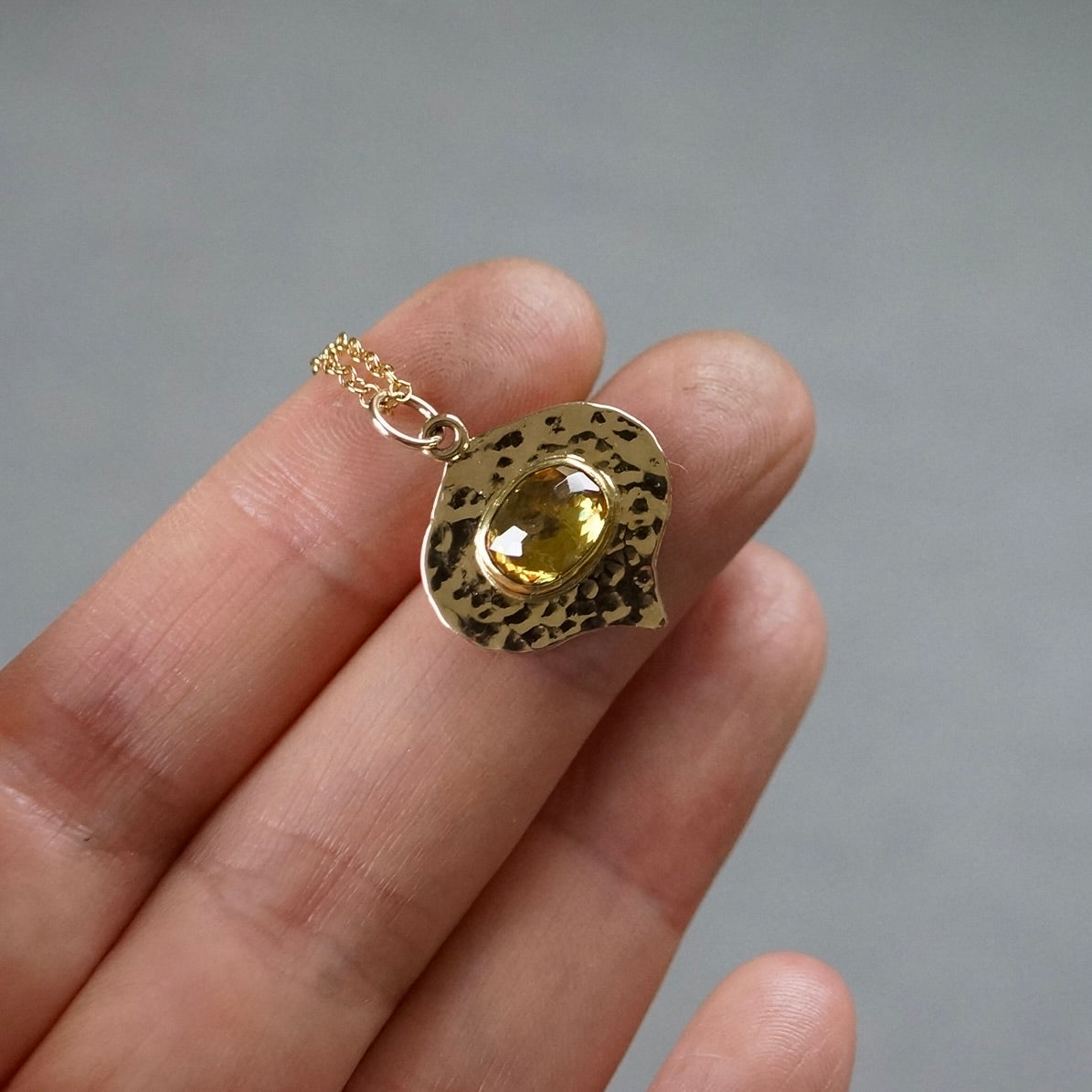 Solid gold green sphene pendant