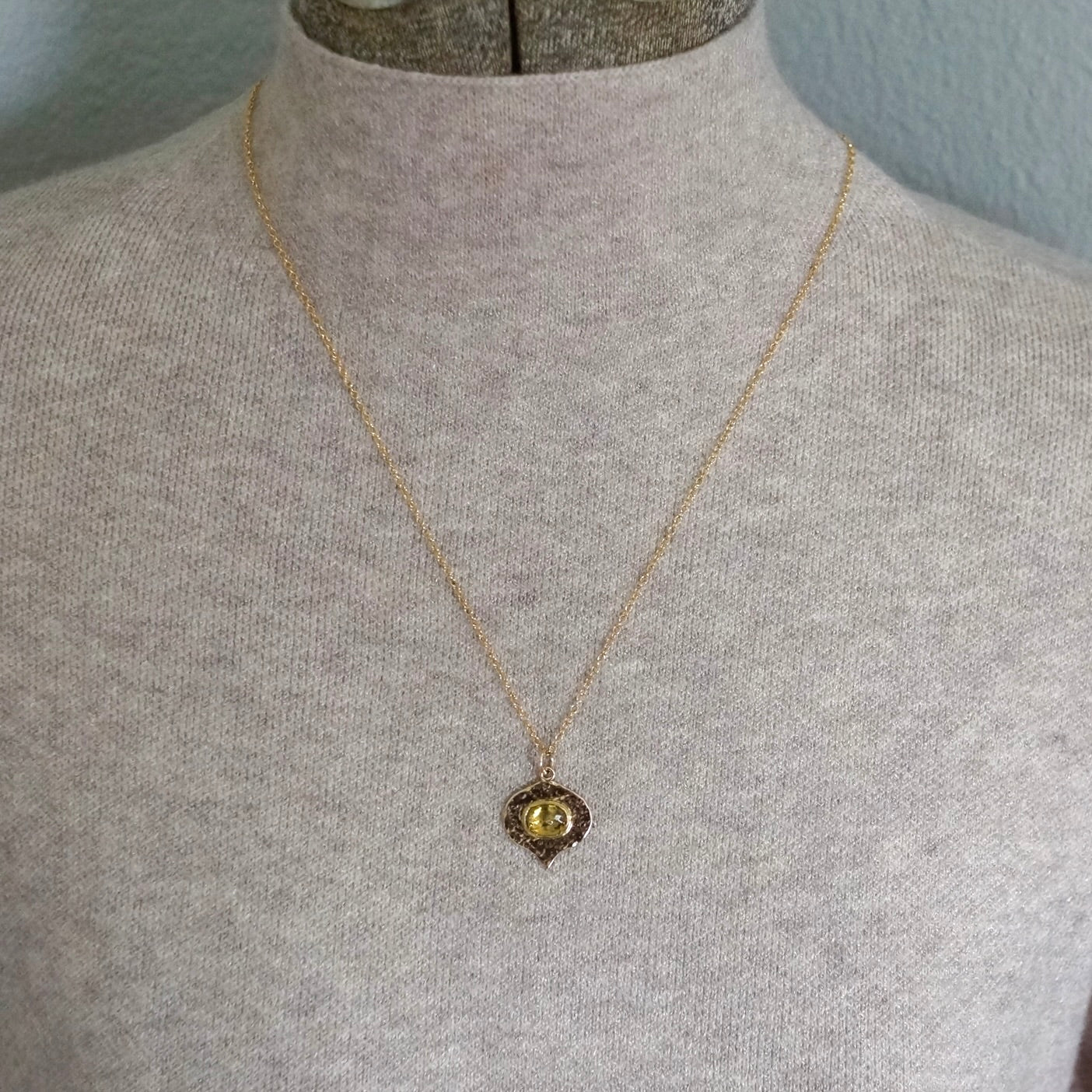 Solid gold green sphene pendant