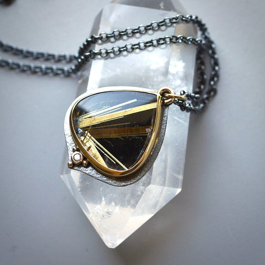 Rutilated quartz and back onyx doublet pendant with diamond