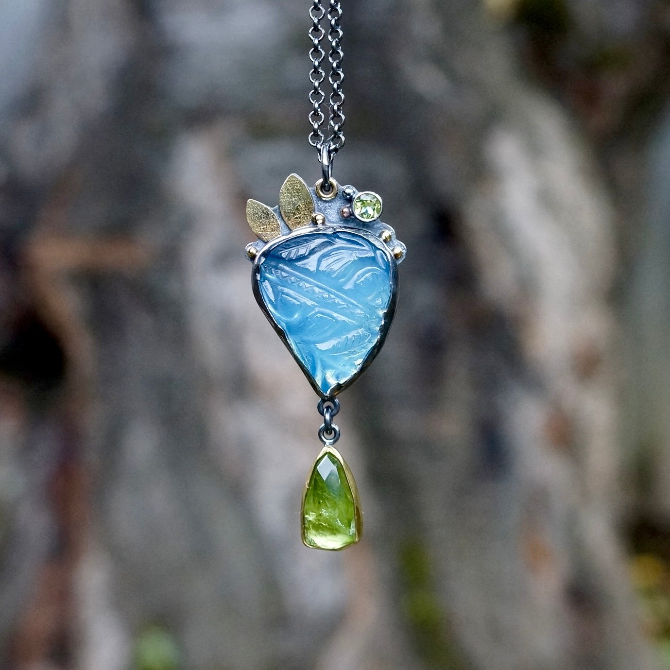 Carved aquamarine and green tourmaline pendant