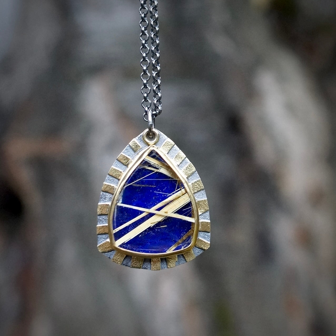 Rutilated quartz and lapis doublet pendant