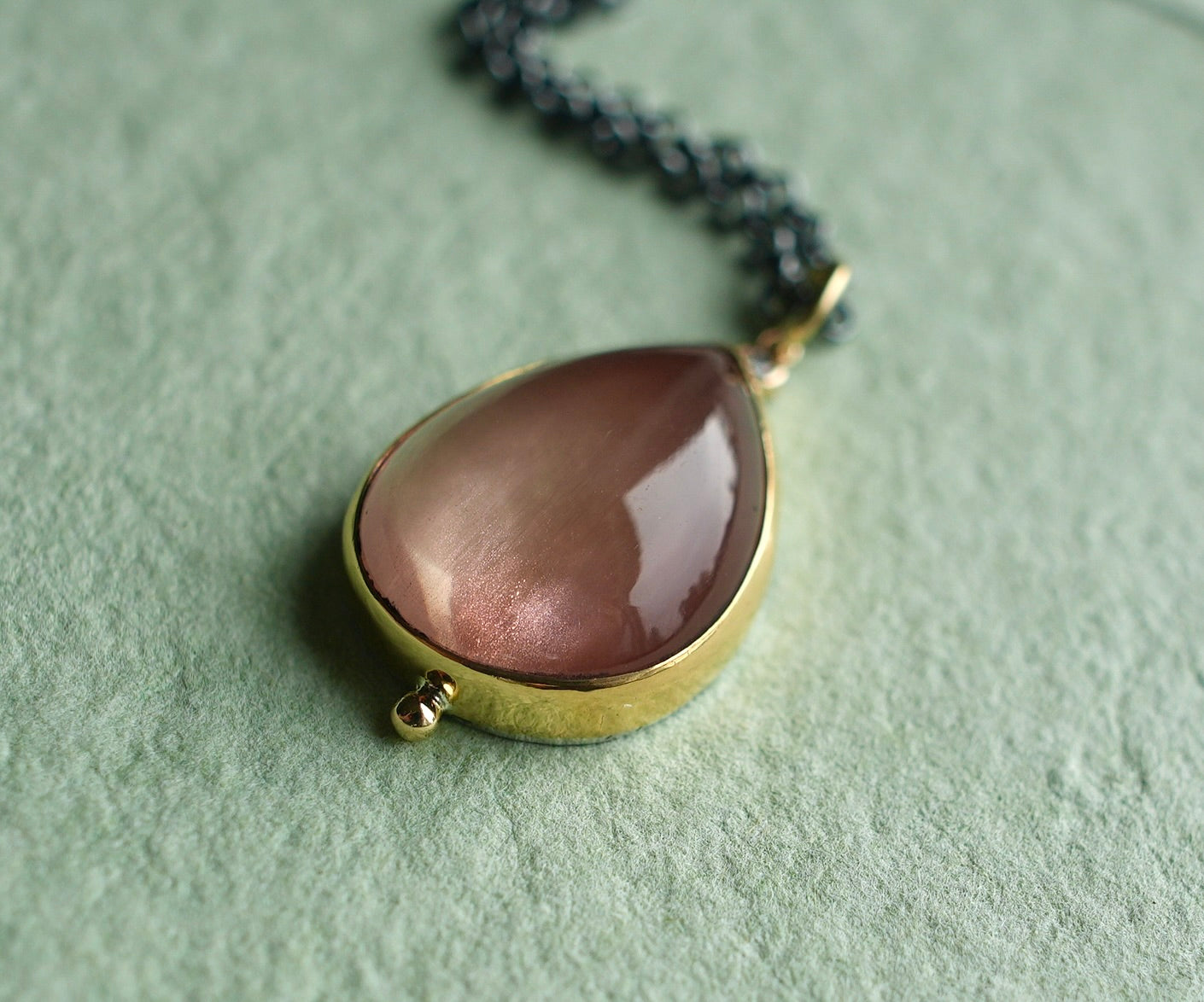 Oregon sunstone and diamond pendant