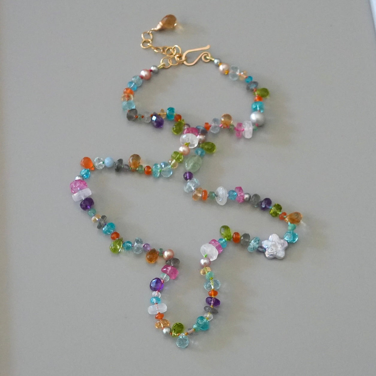 Vibrant gemstone mix silk-knotted necklace with a pearl flower