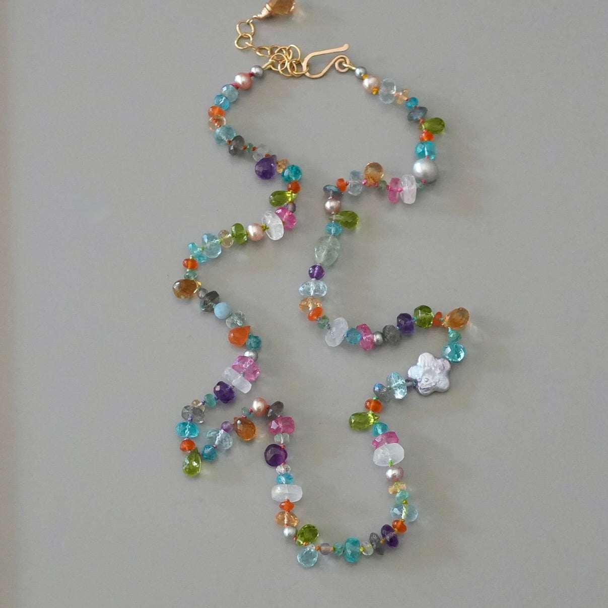 Vibrant gemstone mix silk-knotted necklace with a pearl flower