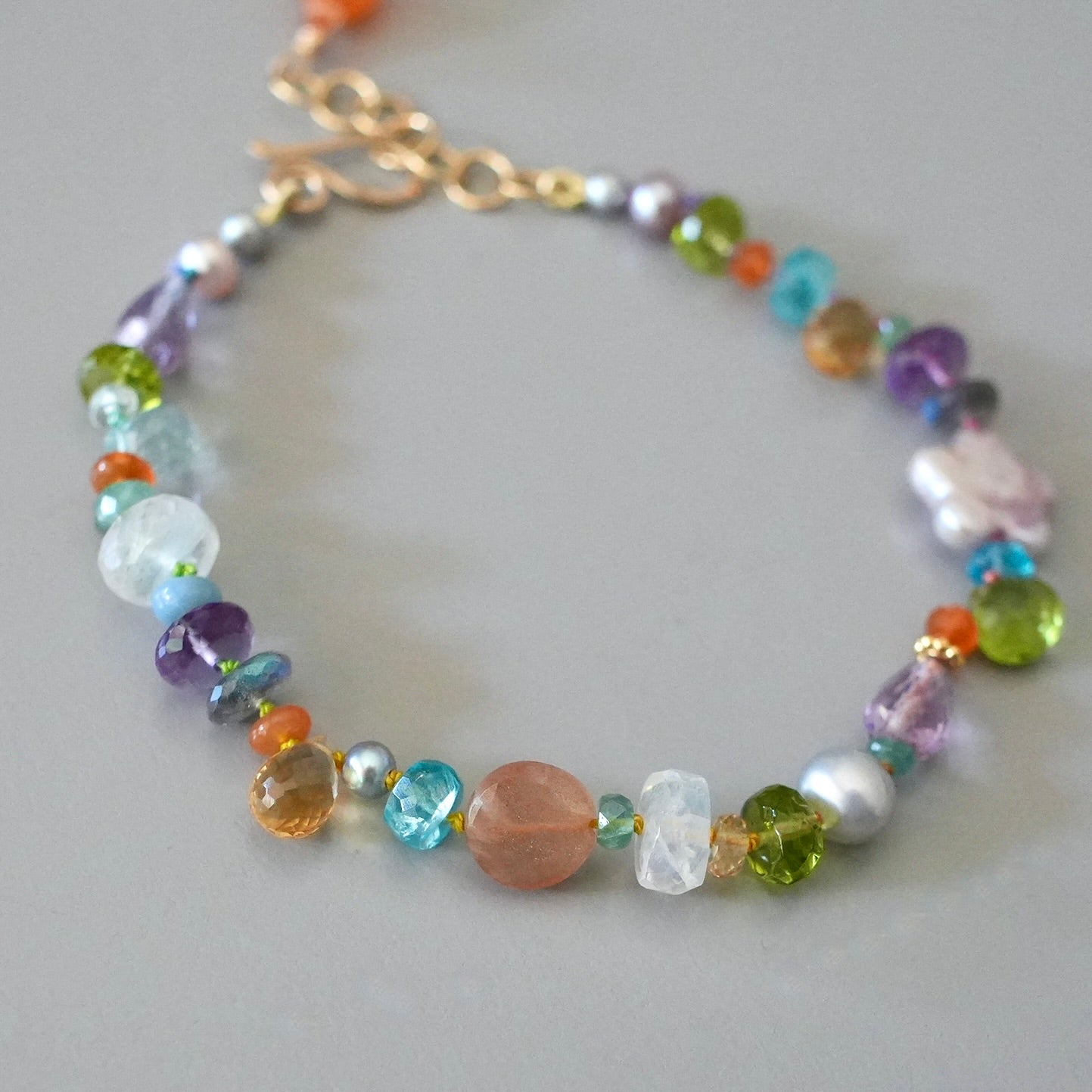 Vibrant gemstone mix silk-knotted bracelet with pearl flower