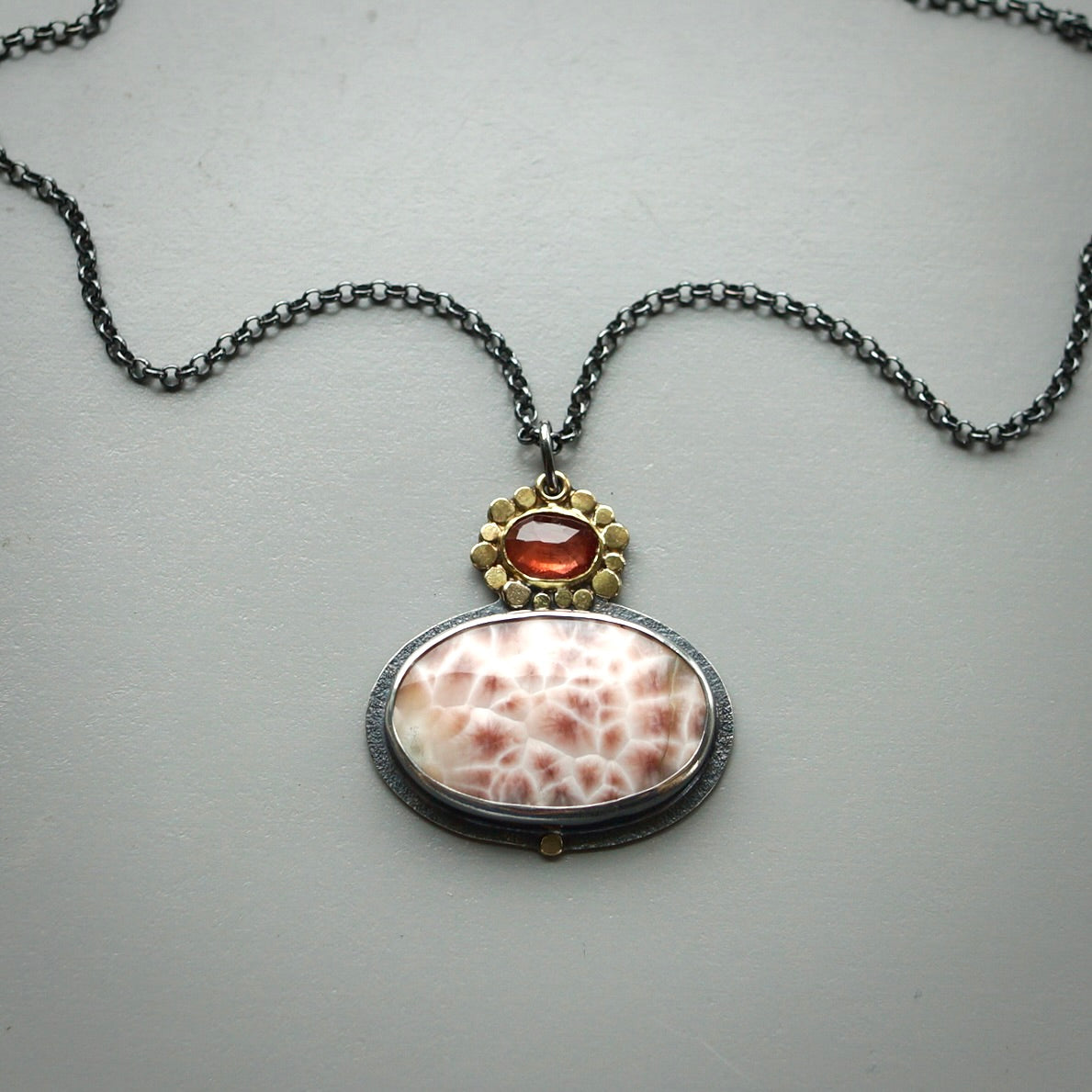 Thomsonite and sapphire pendant