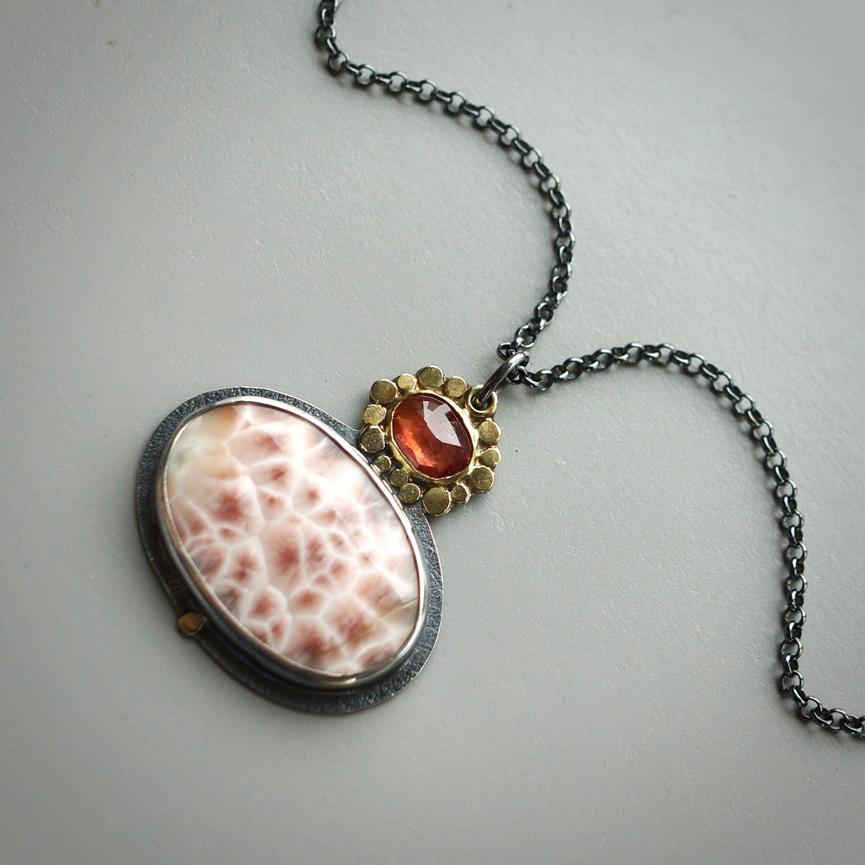 Thomsonite and sapphire pendant