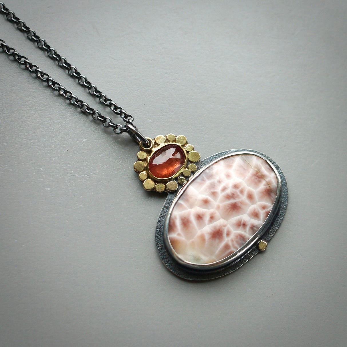 Thomsonite and sapphire pendant