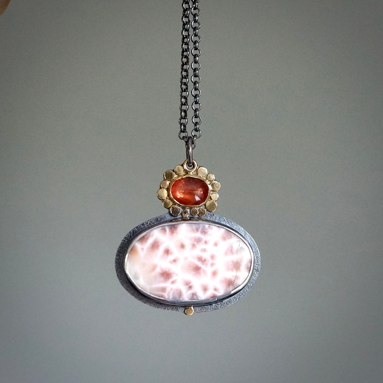 Thomsonite and sapphire pendant