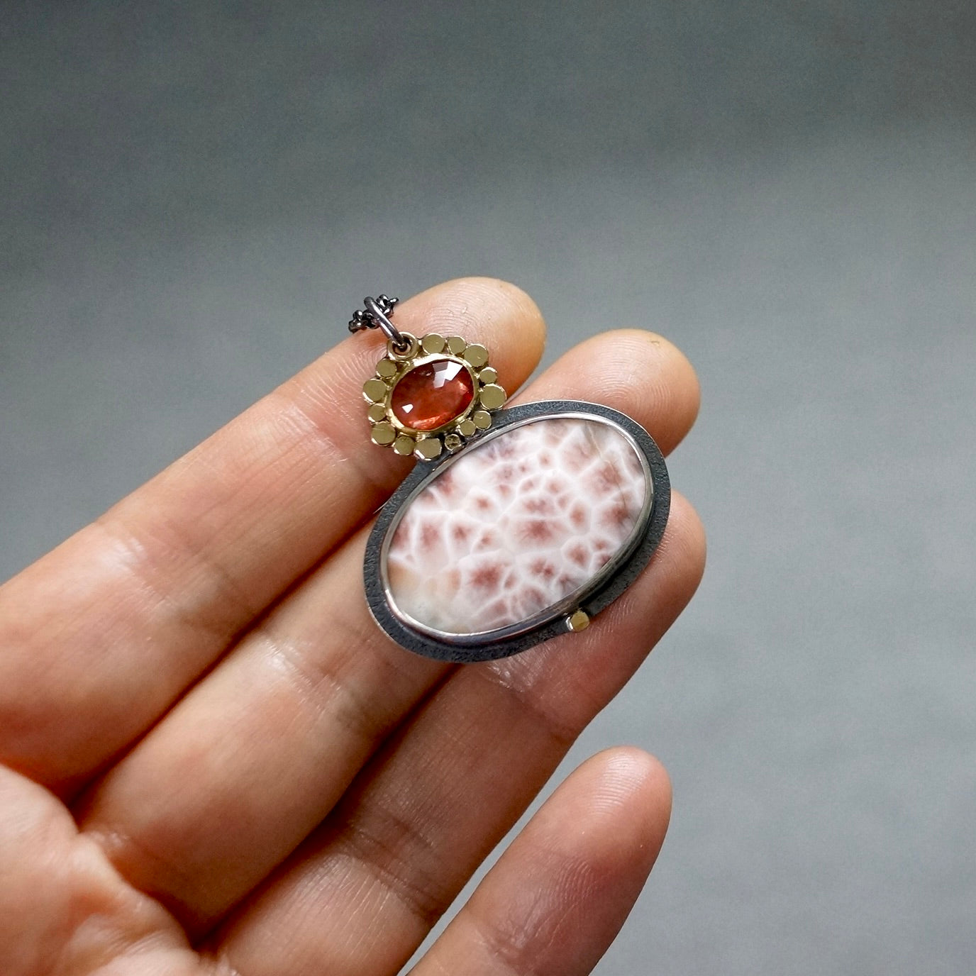 Thomsonite and sapphire pendant