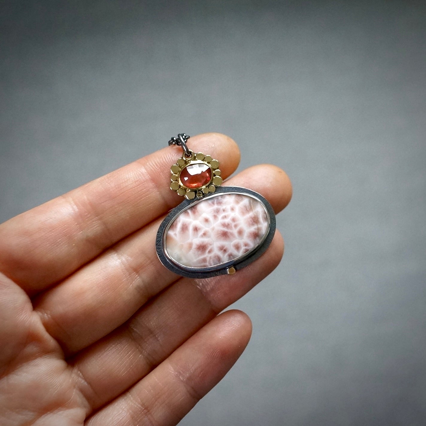 Thomsonite and sapphire pendant