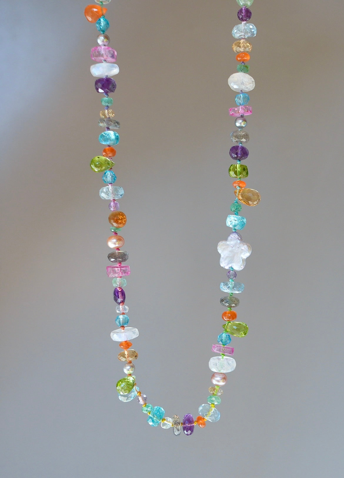 Vibrant gemstone mix silk-knotted necklace with a pearl flower