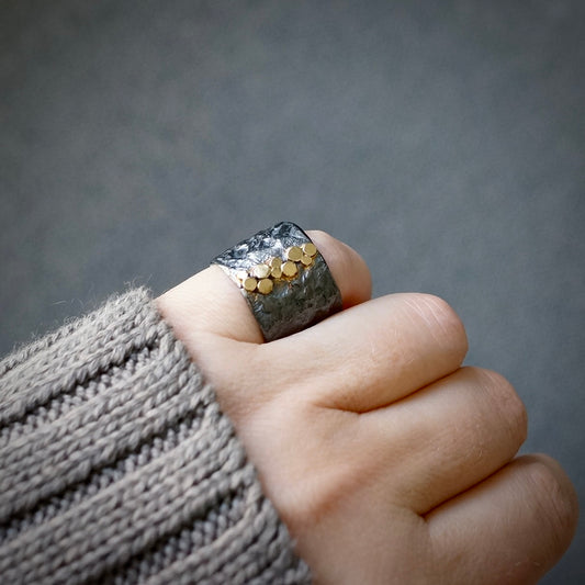 Rustic silver band with gold dots