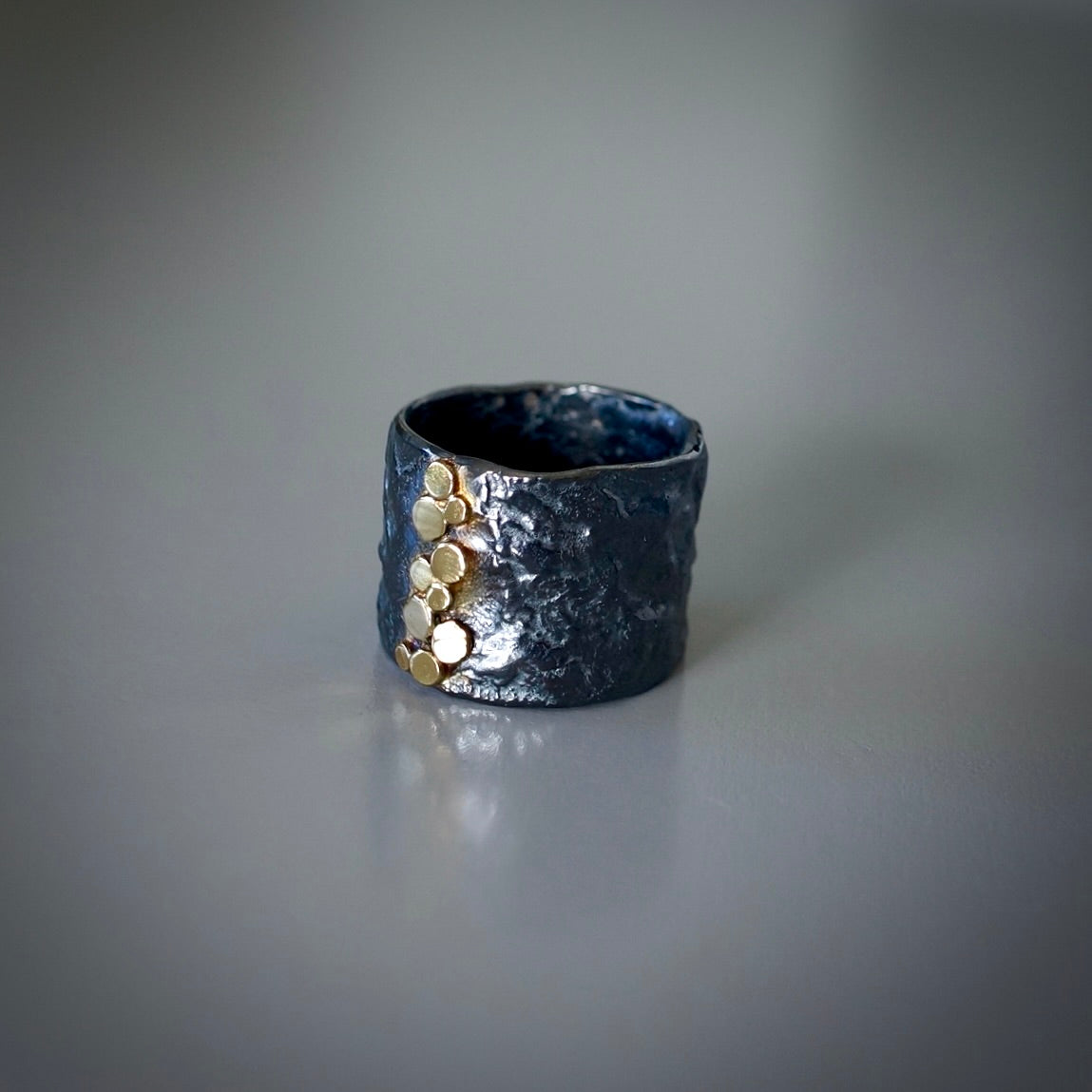 Rustic silver band with gold dots