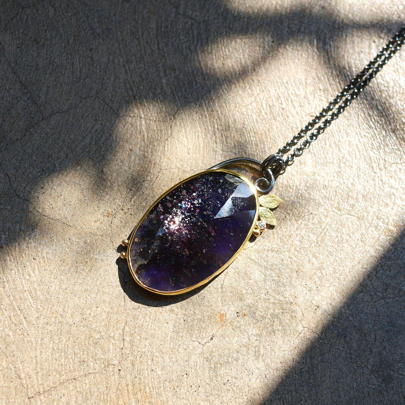 Sunstone Iolite and diamond pendant