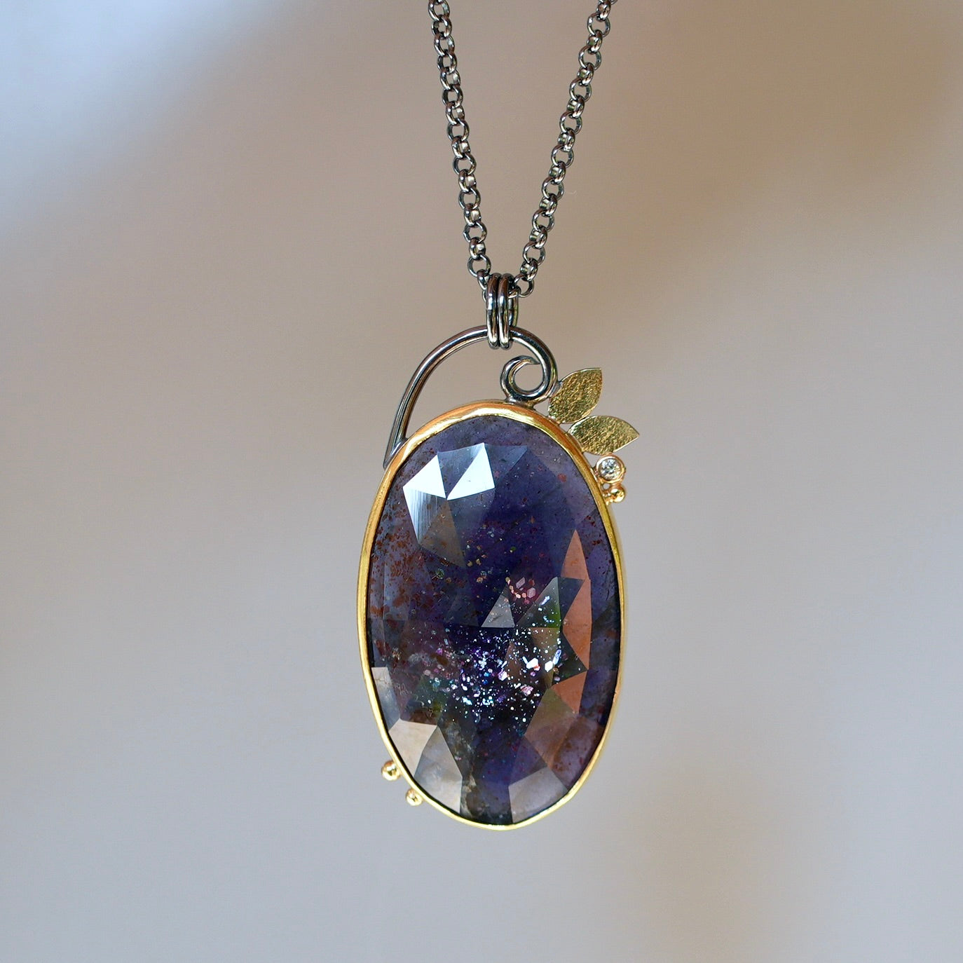 Sunstone Iolite and diamond pendant