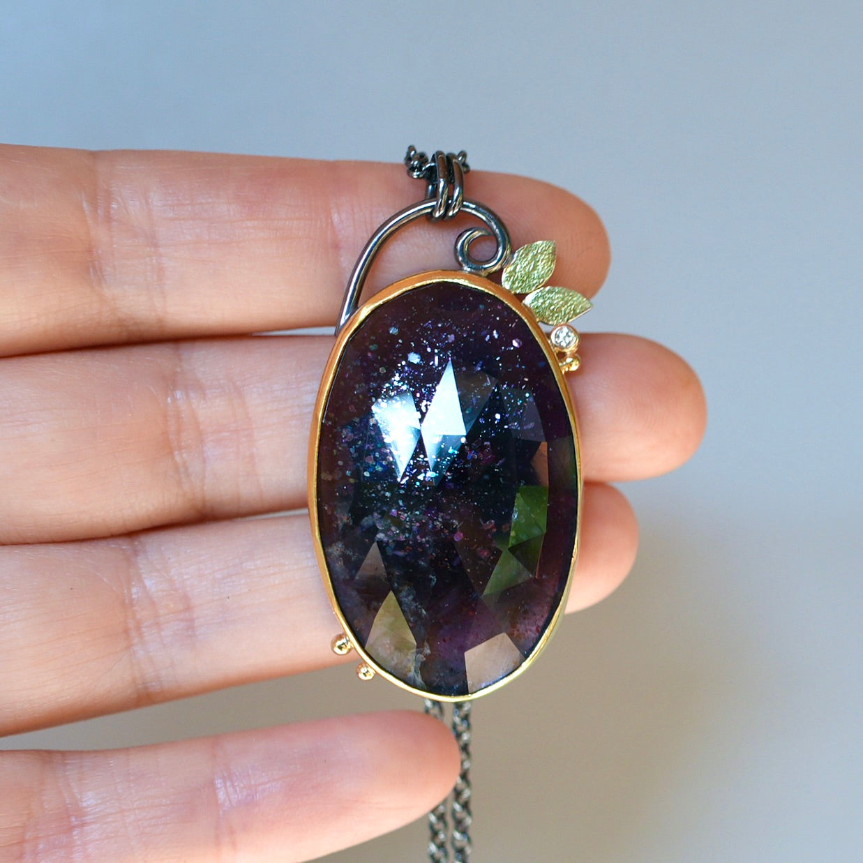 Sunstone Iolite and diamond pendant