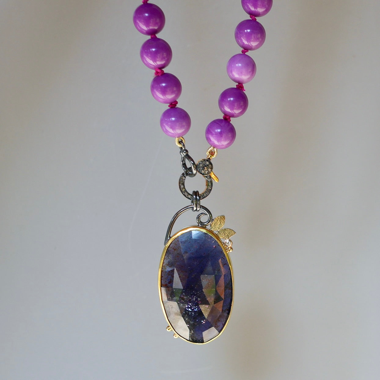 Sunstone Iolite and diamond pendant