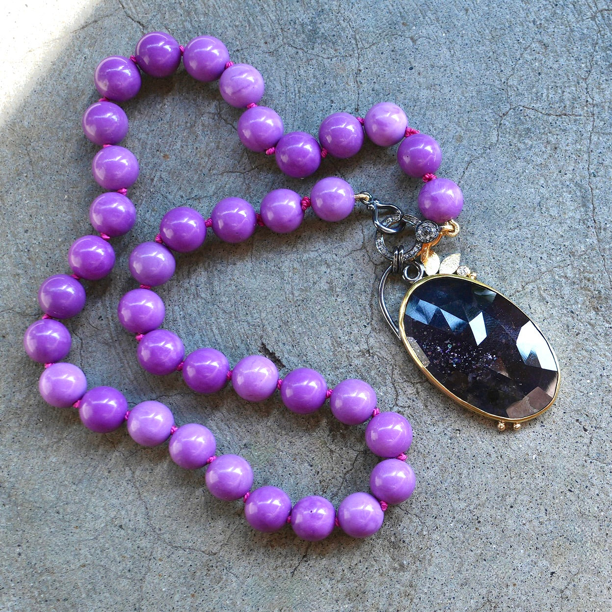 Sunstone Iolite and diamond pendant