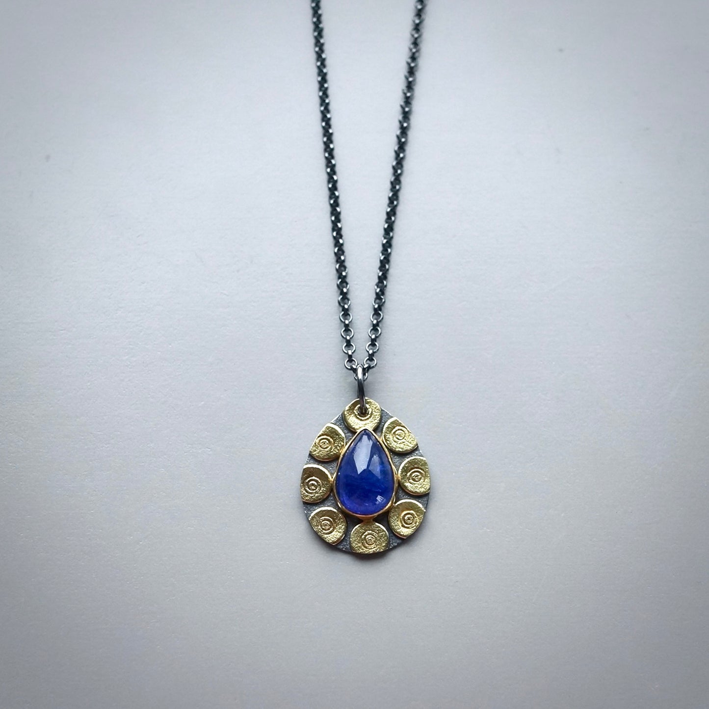Glowing tanzanite pendant
