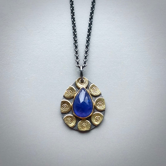 Glowing tanzanite pendant