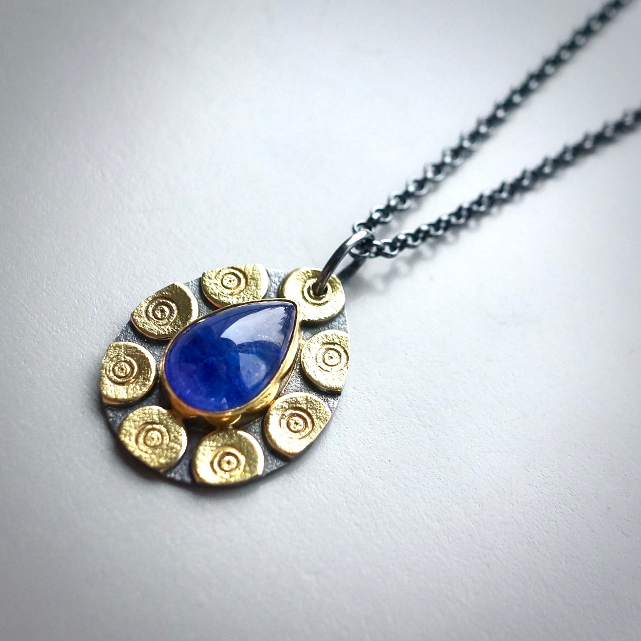 Glowing tanzanite pendant