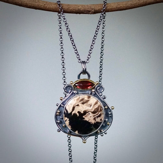 Fossil palm root and garnet pendant