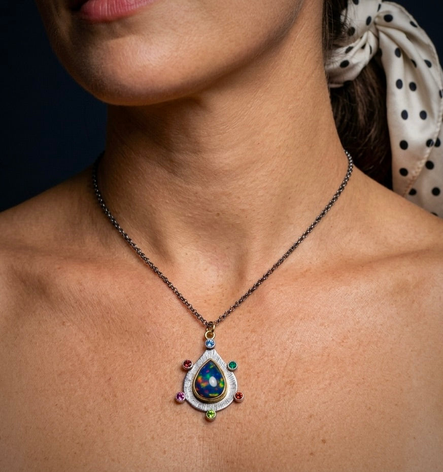 Ethiopian black opal pendant with colorful accents